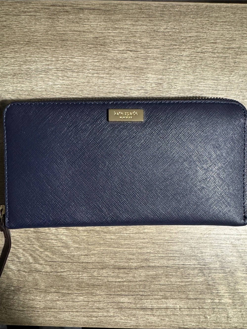 kate spade navy saffiano zip-around continental wallet with gold plaque